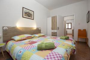 Posteľ alebo postele v izbe v ubytovaní Karmelo Appartment Davorka
