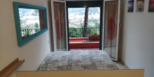 Posteľ alebo postele v izbe v ubytovaní Residence Eurotel da Nella e Stefano + 18 fotografií