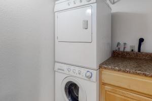 a white washer and dryer in a kitchen at Caballeros Condo in Palm Springs