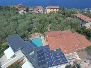 an aerial view of a house with solar panels on the roof at "CASABANA" - relax tutto l'anno - giardino - piscina Top in Malcesine