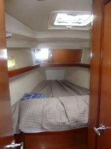 Postel nebo postele na pokoji v ubytování Le Vele Residence Sailing Boat