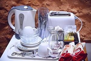 a table with a blender and other items on it at Santrivani Rooms in Chania Town