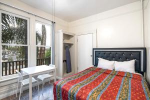 Krevet ili kreveti u jedinici u objektu Mariachi Plaza Hotel