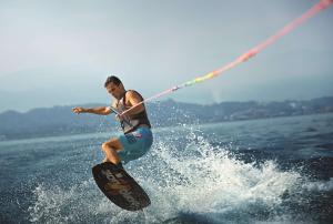 a man is water skiing on the water at Shangri-La Tanjung Aru, Kota Kinabalu in Kota Kinabalu