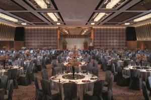 a large banquet hall with tables and chairs at Shangri-La Far Eastern Tainan in Tainan +37 photos