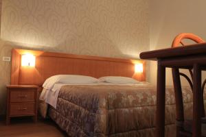 Postel nebo postele na pokoji v ubytování Hotel Kristina