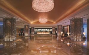 a large room filled with lots of furniture and lights at Shangri-La Qingdao in Qingdao