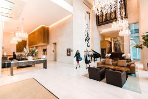 a lobby of a building with people walking in it at Shangri-La Vancouver in Vancouver