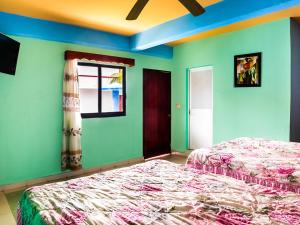 Cama o camas de una habitación en Hotel El Faro