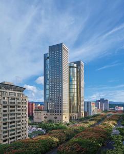 a city with tall buildings and tall buildings at Shangri-La Far Eastern, Taipei in Taipei