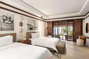Una cama o camas en una habitación de Shangri-La Le Touessrok, Mauritius