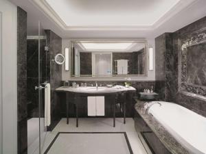 
a bathroom with a tub, sink, and mirror at Shangri-La Bosphorus, Istanbul in Istanbul
