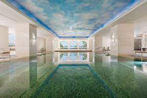a pool in a building with a ceiling filled with water at Shangri-La Bosphorus, Istanbul in Istanbul