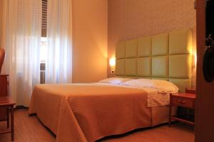 Postel nebo postele na pokoji v ubytování Hotel Kristina
