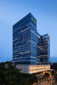 a tall building with a sign on the side of it at Shangri-La Bengaluru in Bangalore