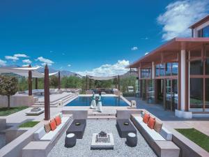 a pool with two people standing next to a building at Shangri-La Lhasa in Lhasa