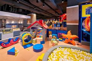 a childrens play area with toys and a play set at Shangri-La Xiamen - Seaside Hotel &Free Mini Bar in Xiamen