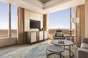 TV a/nebo společenská místnost v ubytování Shangri-La Songbei, Harbin