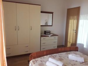 Postel nebo postele na pokoji v ubytování Apartmani Prpić