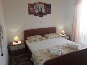 Postel nebo postele na pokoji v ubytování Apartmani Prpić