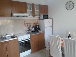 Kuchyň nebo kuchyňský kout v ubytování Apartmani Prpić