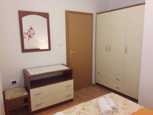 Postel nebo postele na pokoji v ubytování Apartmani Prpić