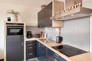 Kuchyň nebo kuchyňský kout v ubytování Appartement Amelanderoase 83 im Amelander Paradijs + 8 fotografií