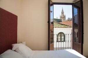 Cama o camas de una habitación en Guzman El Bueno Suites