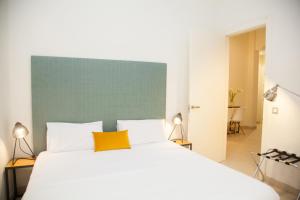 Posteľ alebo postele v izbe v ubytovaní Guzman El Bueno Suites
