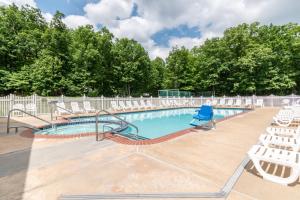 a swimming pool with chairs and a slide at Spring Gulch A-Frame House 8 in Mount Airy