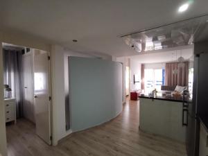 A kitchen or kitchenette at Otylia La Calma Sun Apartment With Sea View