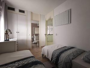 A bed or beds in a room at Otylia La Calma Sun Apartment With Sea View