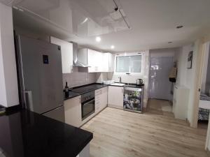 A kitchen or kitchenette at Otylia La Calma Sun Apartment With Sea View