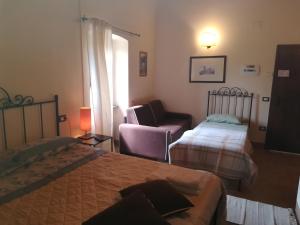 A bed or beds in a room at CASALE SAN FORTUNATO