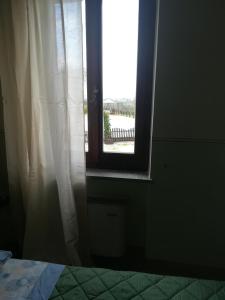 A bed or beds in a room at CASALE SAN FORTUNATO