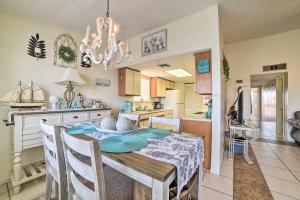 a kitchen and dining room with a dining table and a dining room at Canalfront Retreat with Dock, Hot Tub and Pool Access! in Corpus Christi