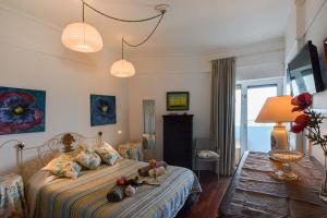 a bedroom with a bed with stuffed animals on it at Marina Tower Center in Ponta Delgada