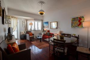 a living room with a couch and a table at Marina Tower Center in Ponta Delgada