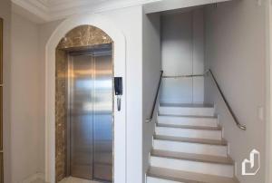 a staircase leading to a door in a house at Apartamento vista para o mar com 02 dormitórios in Canto Grande +25 photos