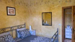 a bedroom with a bed and a mirror on the wall at House Avena with spa & gym in Labin