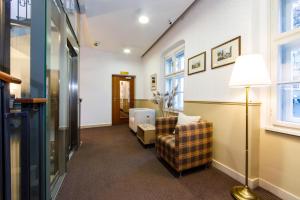 A bed or beds in a room at BEIGLI Hotel & Garden