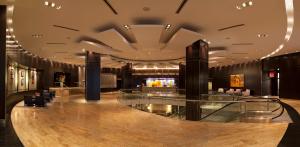 a lobby of a hotel with a bar at InterContinental Toronto Centre, an IHG Hotel in Toronto