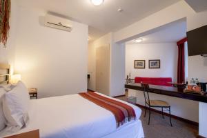 Postel nebo postele na pokoji v ubytování Tierra Viva Machu Picchu Hotel