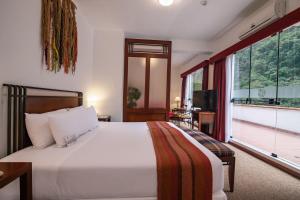 Postel nebo postele na pokoji v ubytování Tierra Viva Machu Picchu Hotel