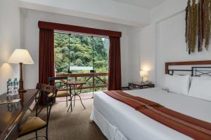 Postel nebo postele na pokoji v ubytování Tierra Viva Machu Picchu Hotel