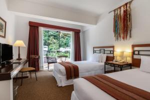 Postel nebo postele na pokoji v ubytování Tierra Viva Machu Picchu Hotel