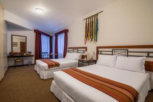 Postel nebo postele na pokoji v ubytování Tierra Viva Machu Picchu Hotel
