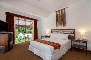 Postel nebo postele na pokoji v ubytování Tierra Viva Machu Picchu Hotel