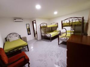 Postel nebo postele na pokoji v ubytování Hostal El Naufrago 1
