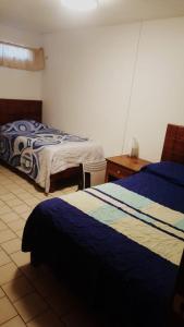 Postel nebo postele na pokoji v ubytování Hotel Centric Chihuahua